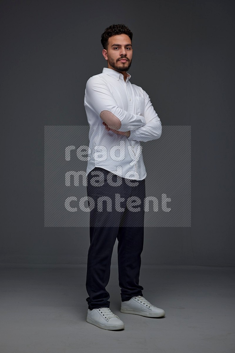 A man wearing smart casual making multi stand poses  eye level on a gray background