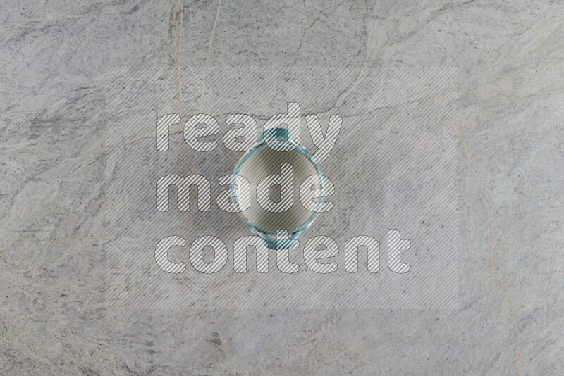 A multicolored pottery Bowl on grey marble background