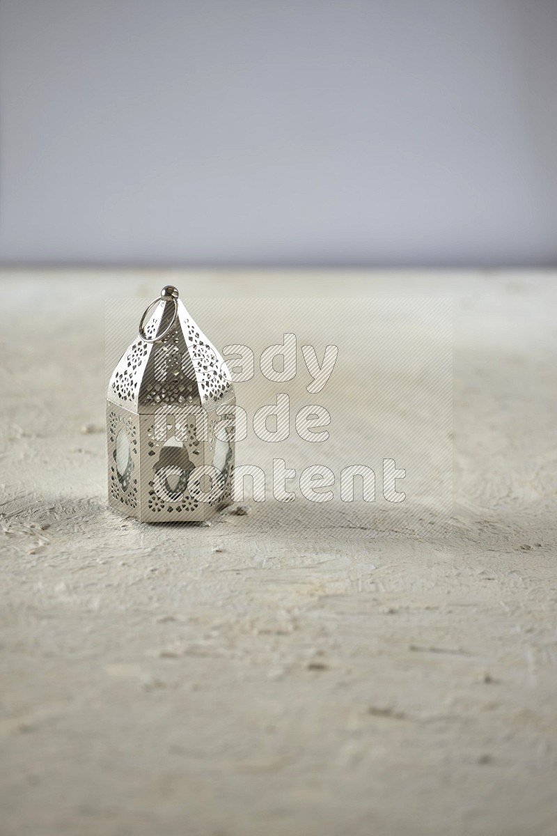 A lantern on textured white background