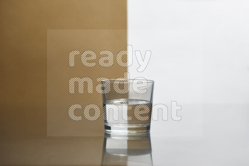 The image features a clear glassware filled with water, set against white and beige background