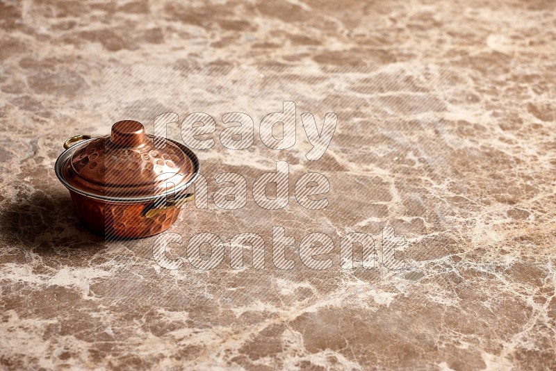 Small Copper Pot on Beige Marble Flooring, 45 degrees