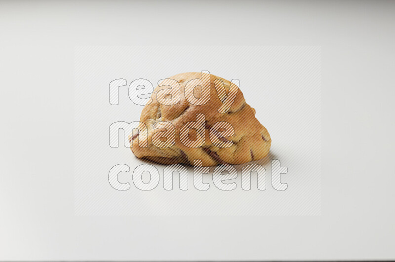 a chocolate chip cookie on a white background