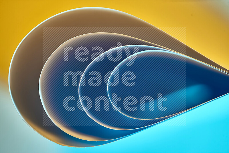 An abstract art of paper folded into smooth curves in blue and yellow gradients