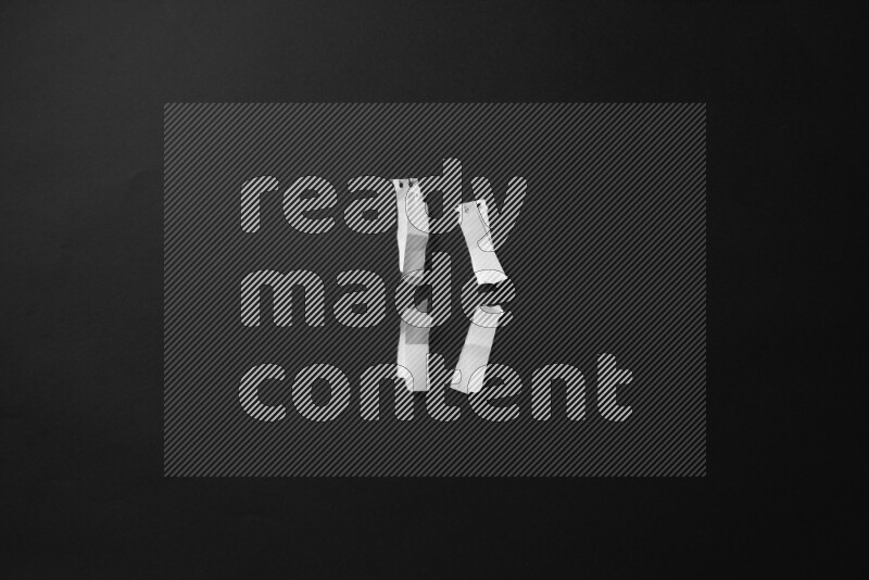 Ripped notebook sheet on black background