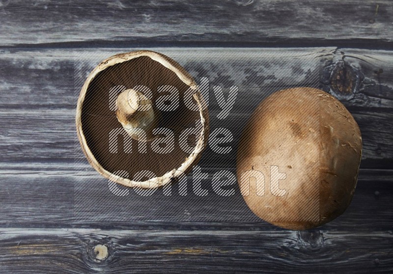 Fresh portobello mushroom topview on a grey wooden textured