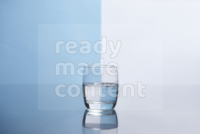 The image features a clear glassware filled with water, set against white and light blue background