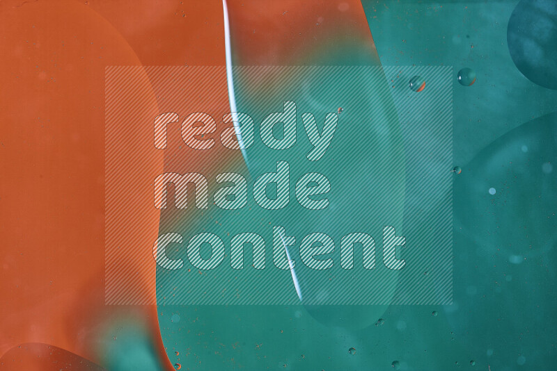 Close-ups of abstract oil bubbles on water surface in shades of green and orange