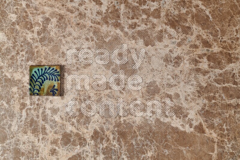 A decorative coaster on beige marble background