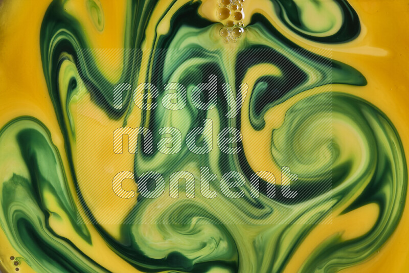 A close-up of abstract swirling patterns in orange and green