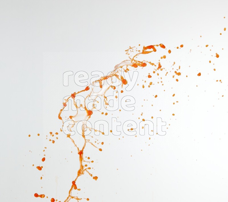 Orange liquid splash and drops on white background