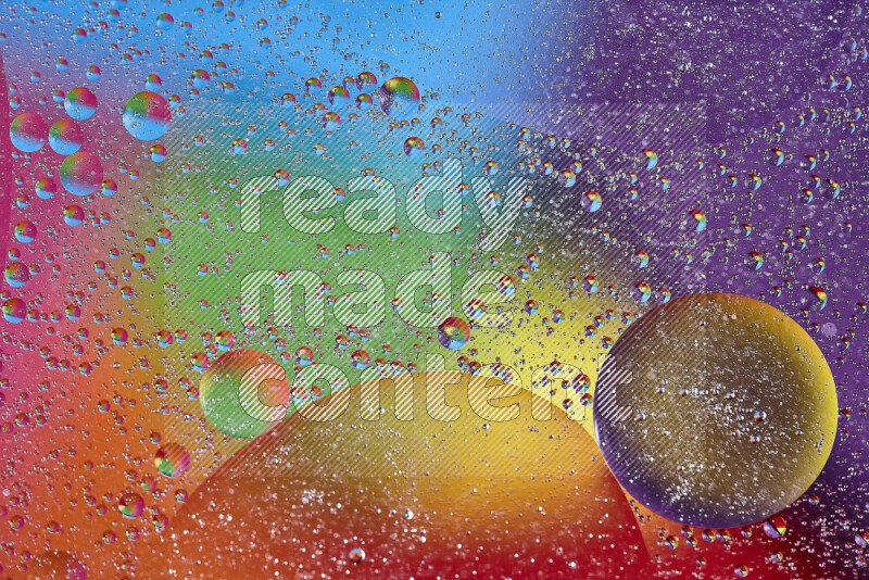 Close-ups of abstract oil bubbles on water surface in multicolors
