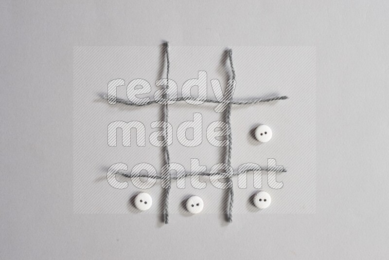 White buttons placed on grey background