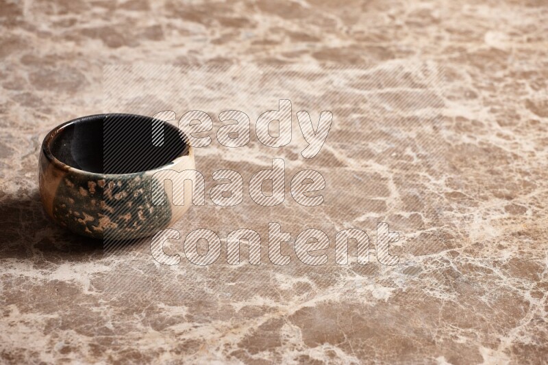 Multicolored Pottery Bowl on Beige Marble Flooring