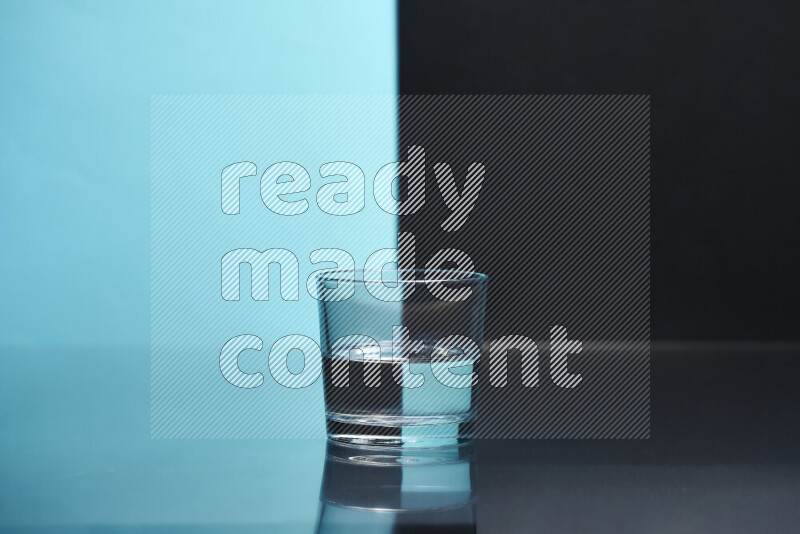 The image features a clear glassware filled with water, set against light blue and black background