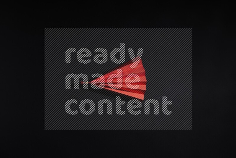 Red paper sheet on black background