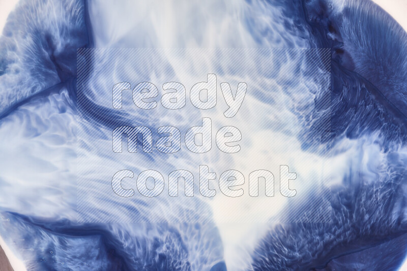 A close-up of abstract swirling patterns in blue and white