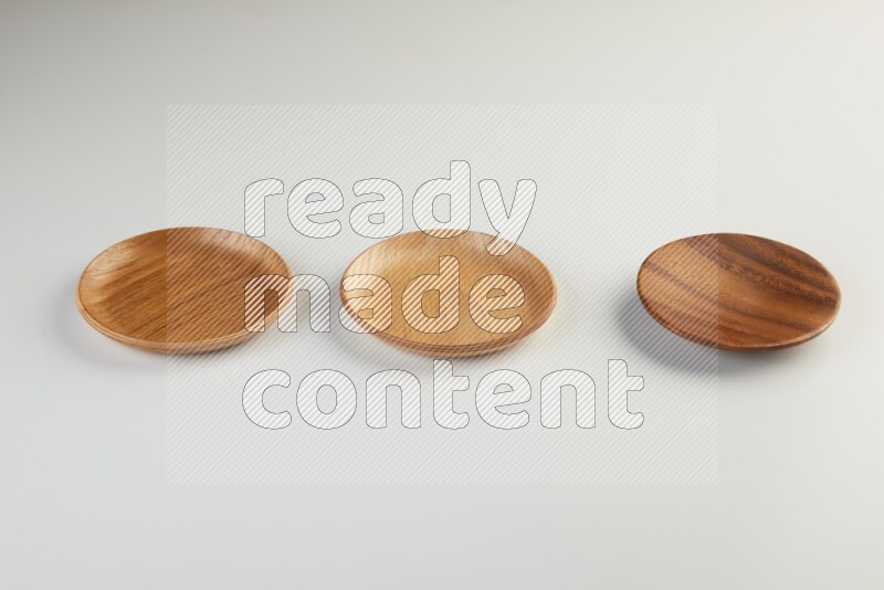 Wooden bowl and plate on white background