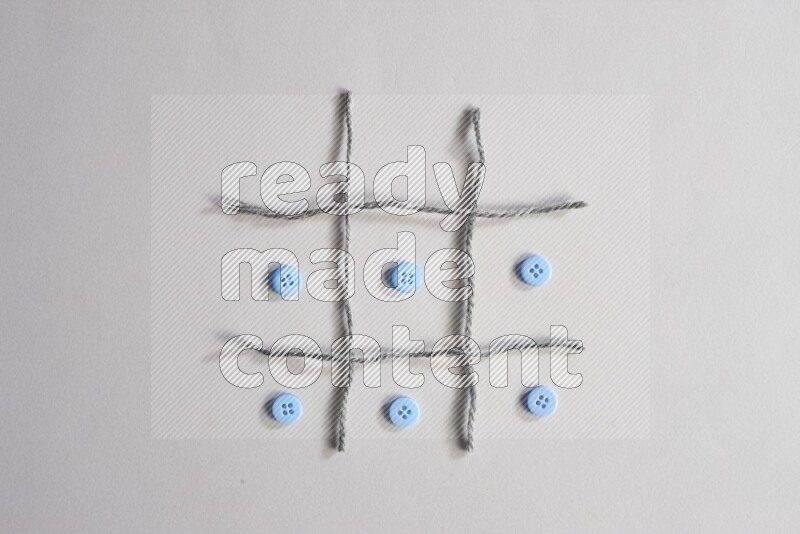 Blue buttons placed on grey background