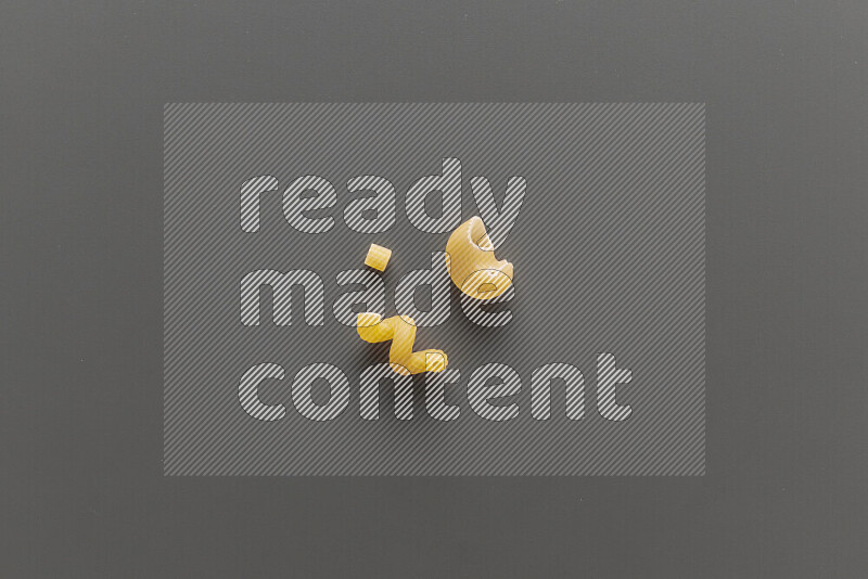 Different pasta types on grey background