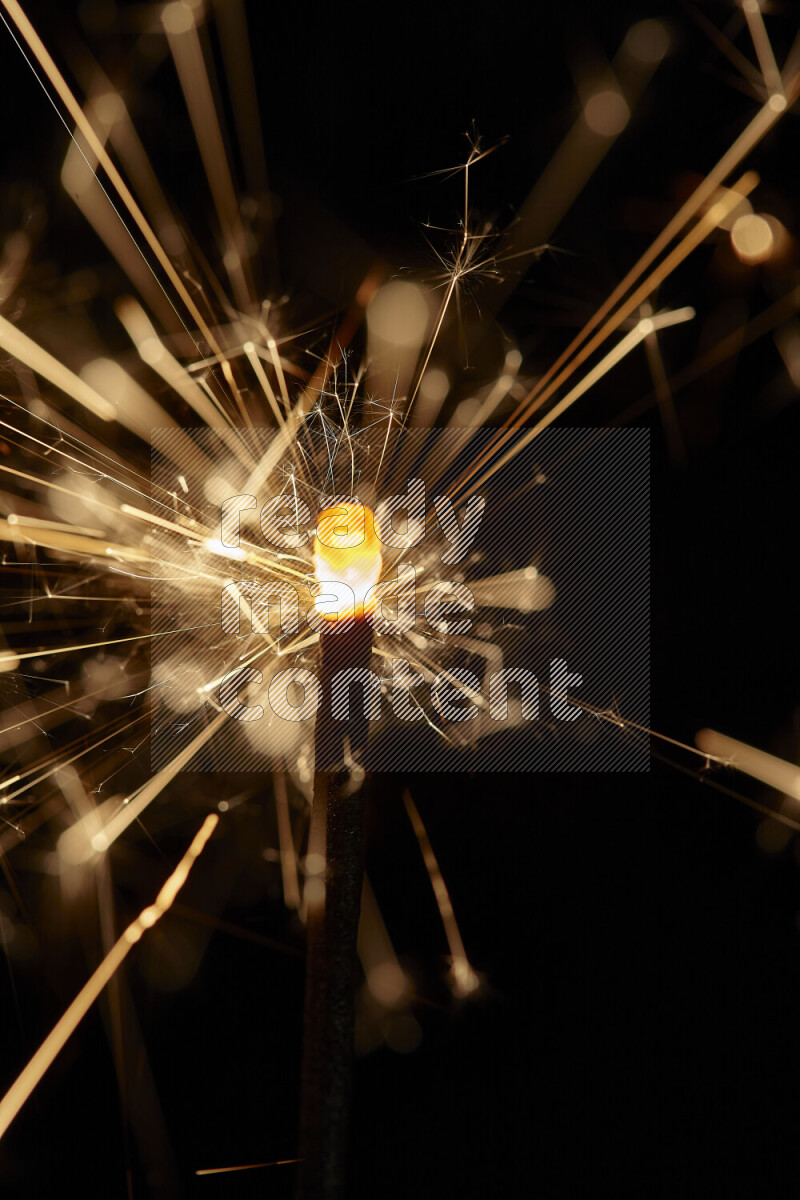 A close-up image of sparkler candle isolated on black background