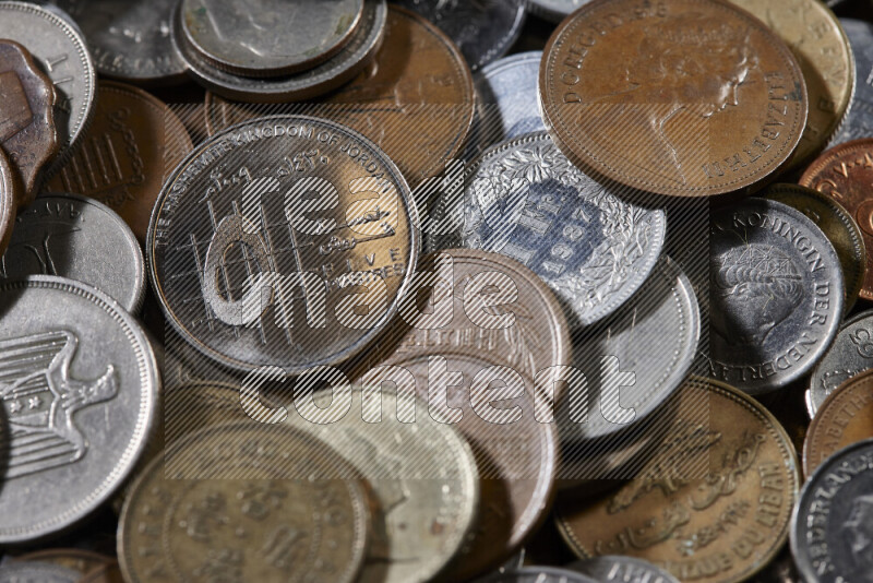 A close-ups of random old coins on black background