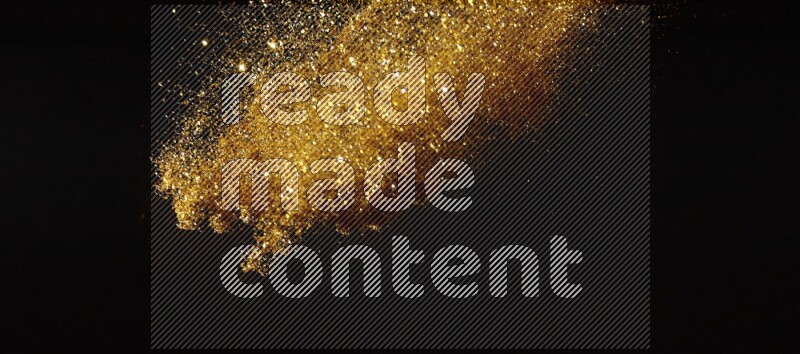 Gold glitter powder isolated on black background