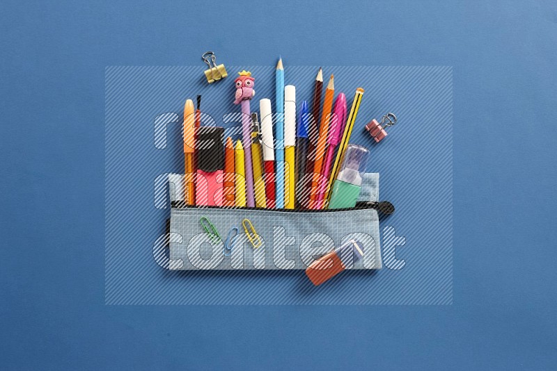 Color pens on blue background (Back to school)