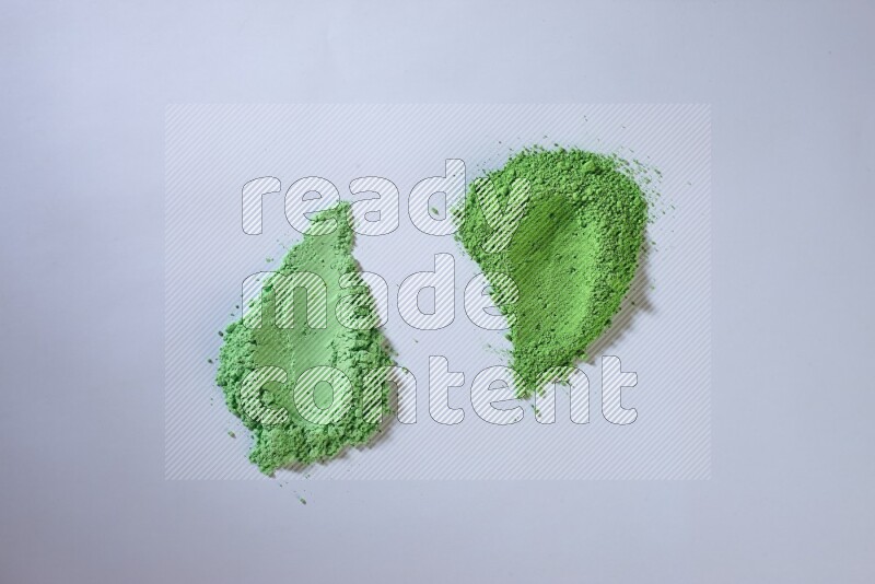 Green powder strokes on white background