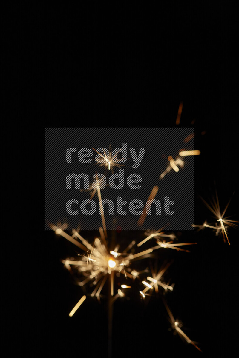 A close-up image of sparkler candle isolated on black background