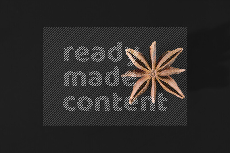Star anise on black background