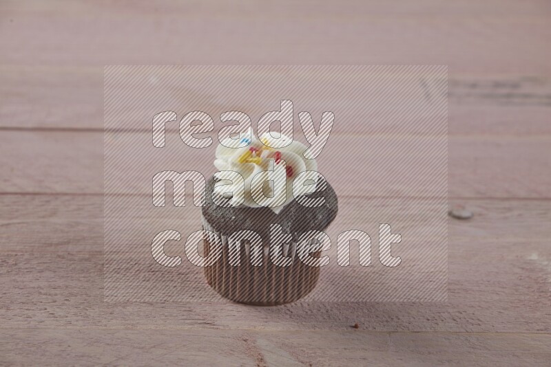 Chocolate mini cupcake topped with cream