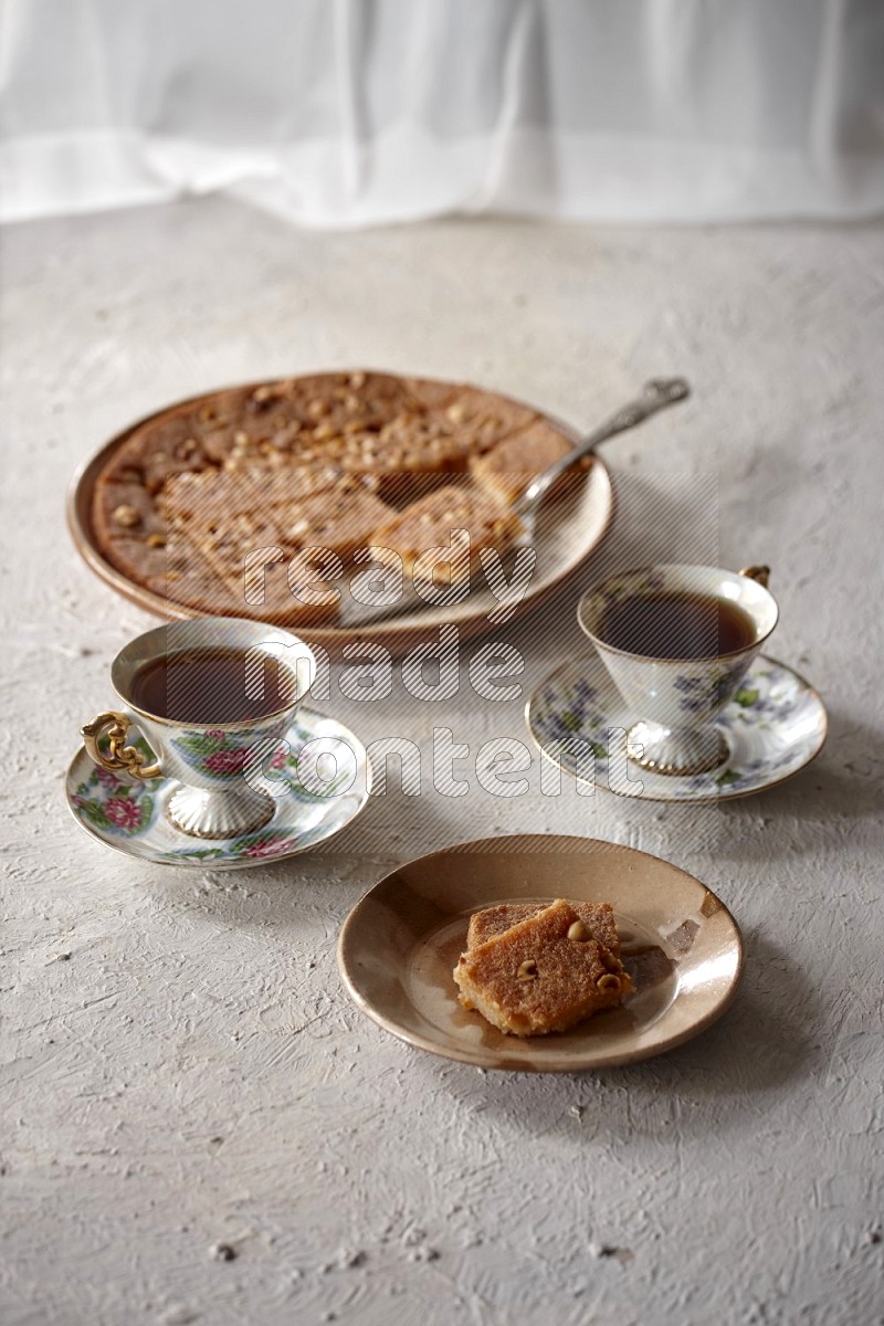 Basbousa with tea in a light setup