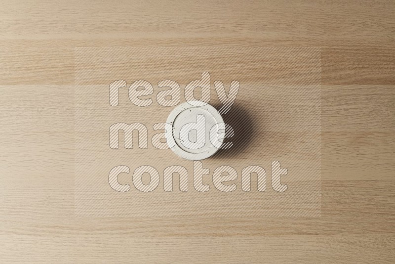 Top View Shot Of A White Pottery Bowl on Oak Wooden Flooring