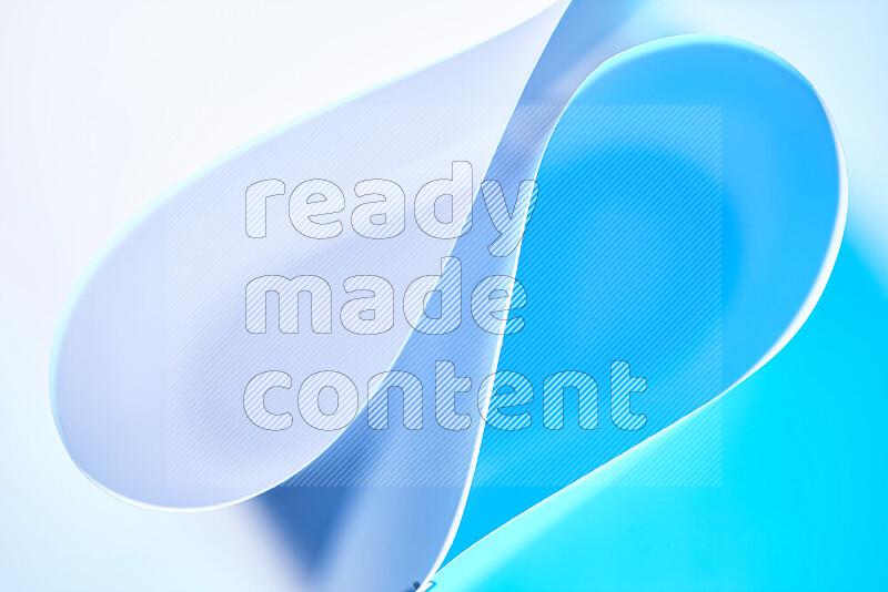 An abstract art of paper folded into smooth curves in white and blue gradients