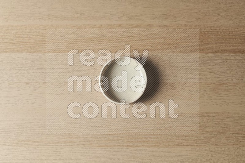 Top View Shot Of A White Pottery Bowl on Oak Wooden Flooring