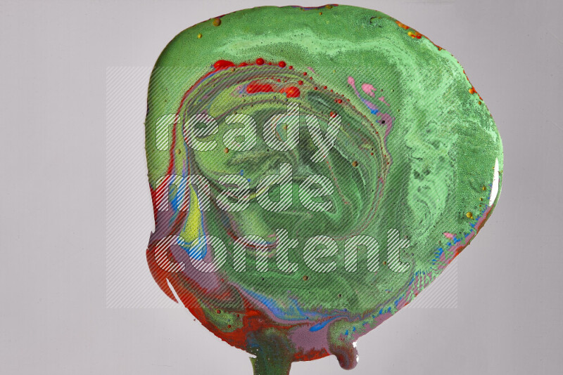 Close-ups of assorted colors blending on a grey background