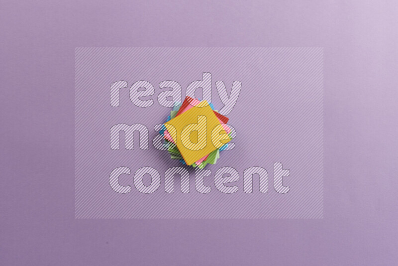 Multicolored sticky notes with school supplies on purple background