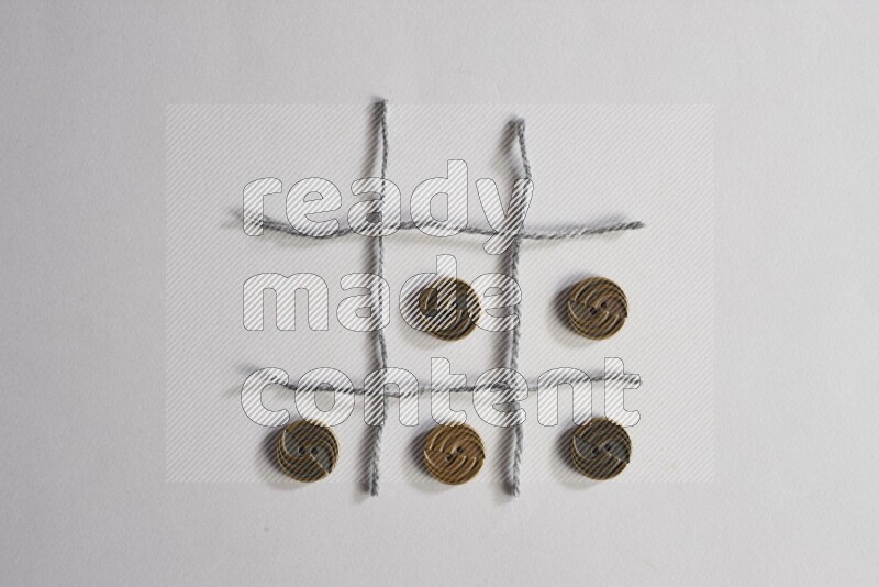 Metal buttons placed on grey background