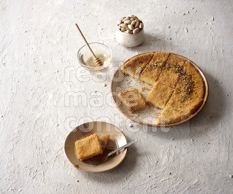 Konafa with nuts and honey in a light setup