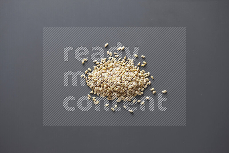 Hulled wheat on grey background