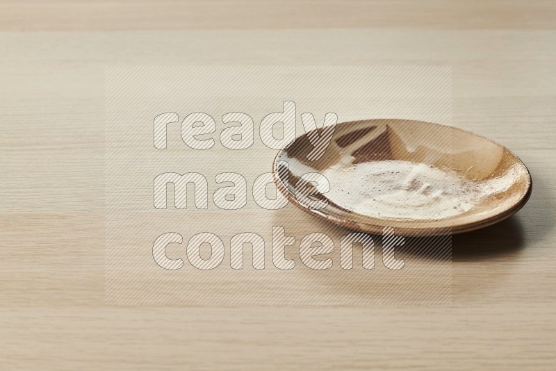 Multicolored Pottery Plate on Oak Wooden Flooring, 15 degrees