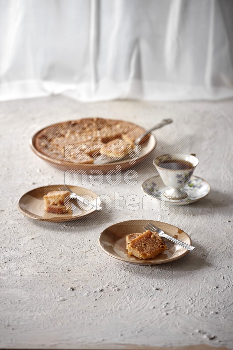 Basbousa with tea in a light setup