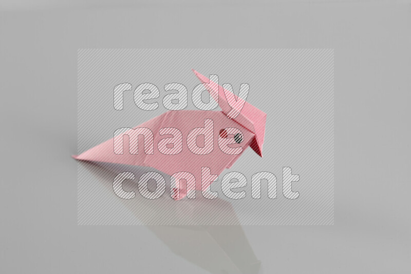 Origami animals on grey background