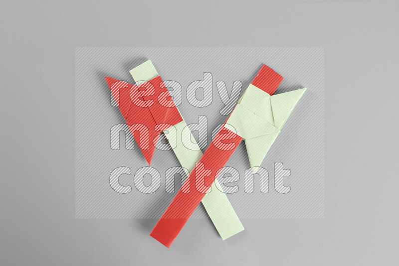 Origami axe on grey background