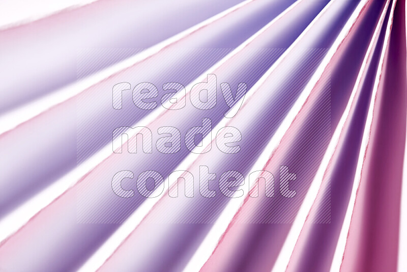 An image presenting an abstract paper pattern of lines in white and purple tones