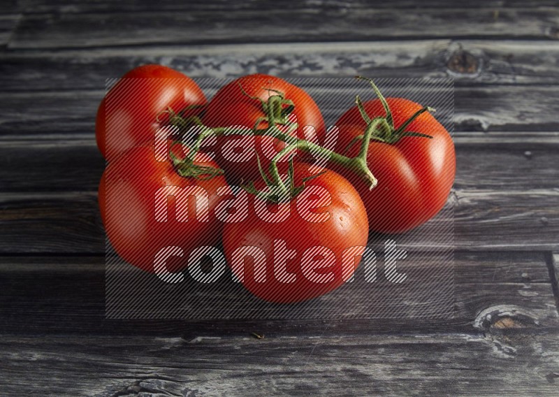 45 degree vein of roma tomato tomato on a textured grey wooden background