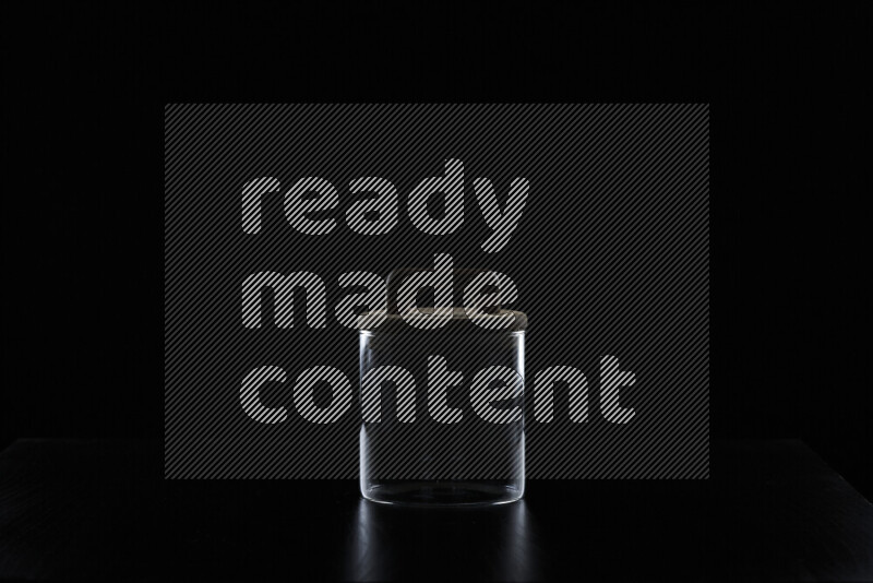 Glassware with rim light against black background