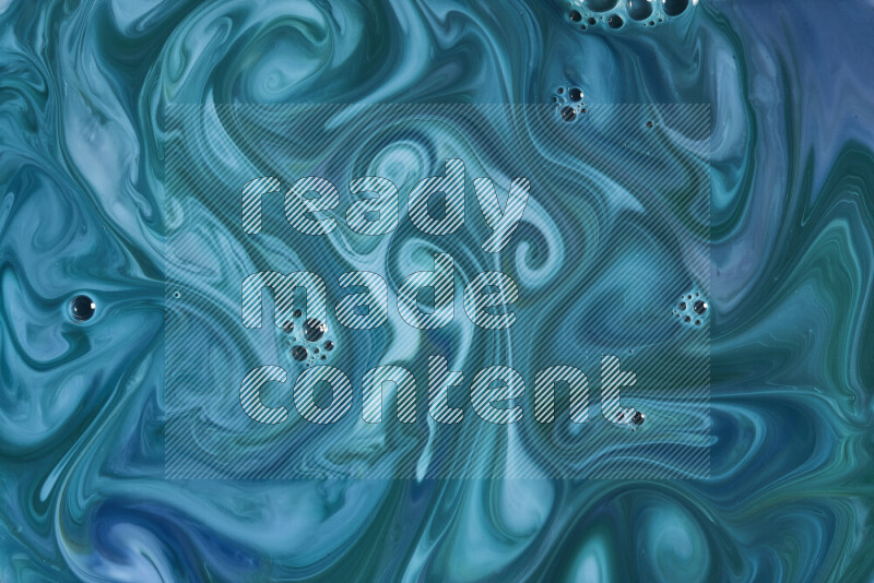 A close-up of abstract swirling patterns in blue and green
