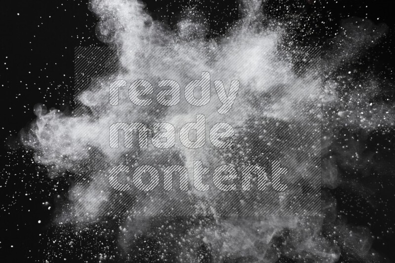 White powder explosion on black background