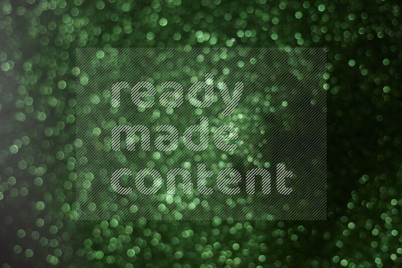 Green glitter powder isolated on black background